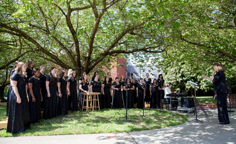 April Duvic leads the Clark College Women&#039;s Choral Ensemble during the 2016 Sakura Festival on campus.