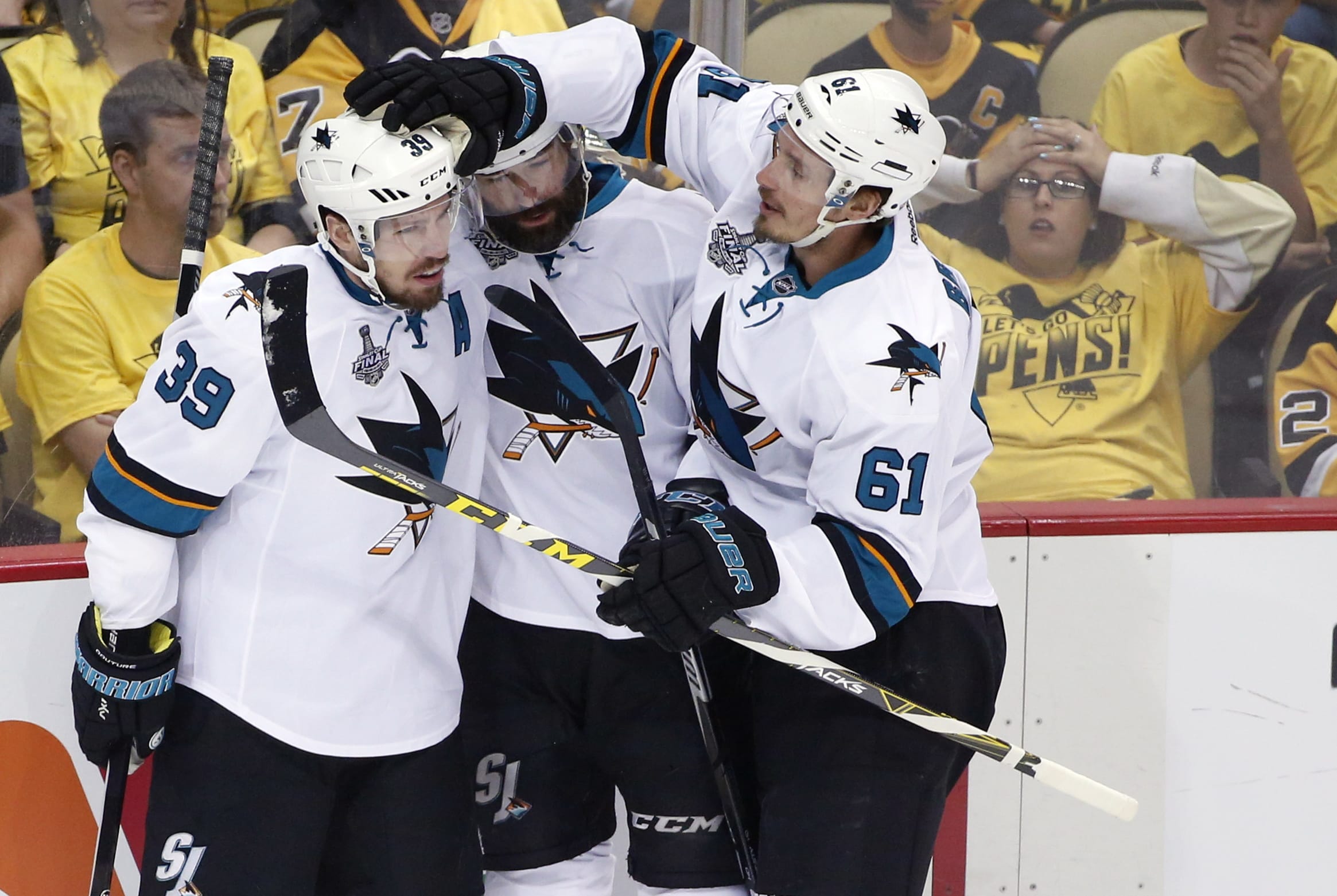 San Jose Sharks' Logan Couture (39) celebrates his goal against the Pittsburgh Penguins with teammates during the first period in Game 5 of the NHL hockey Stanley Cup Finals on Thursday, June 9, 2016, in Pittsburgh. (AP Photo/Gene J.