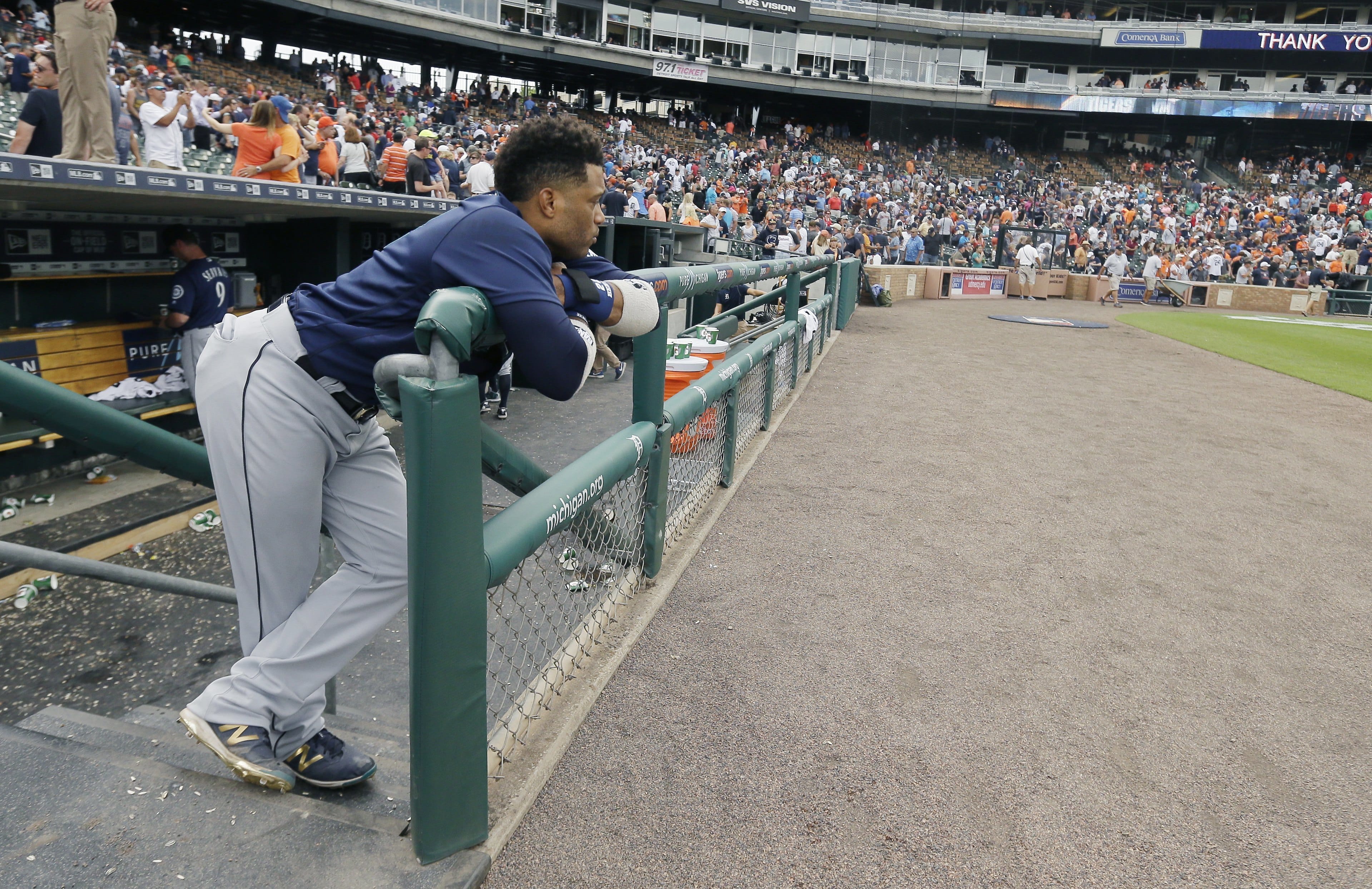 Seattle Mariners' Robinson Cano looks from the dugout after the Detroit Tigers defeated the Mariners in the 10th inning of a baseball game, Thursday, June 23, 2016, in Detroit.