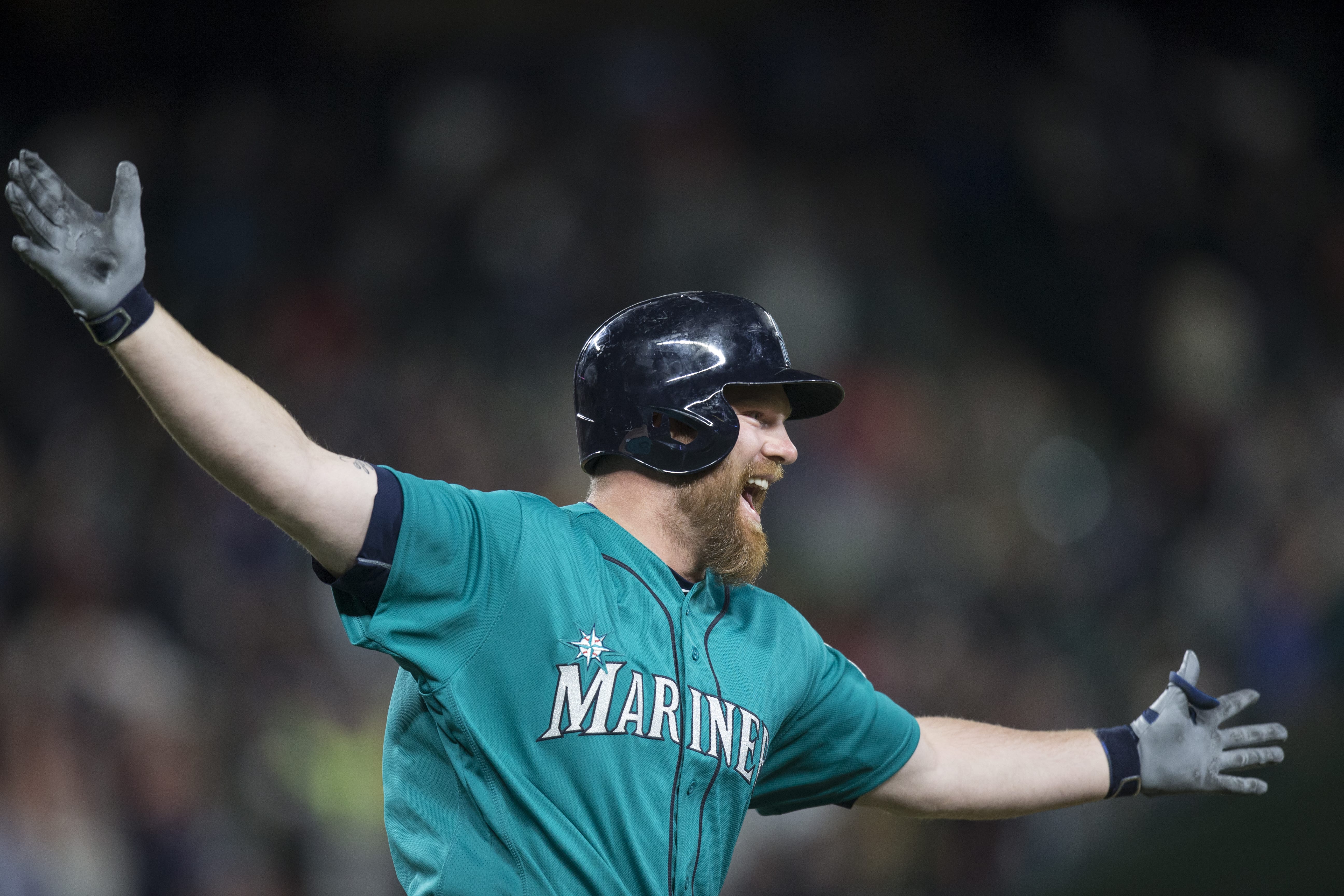 Seattle Mariners' Adam Lind celebrates his three-run home run off of St. Louis Cardinals relief pitcher Trevor Rosenthal during the ninth inning of a baseball game, Friday, June 24, 2016, in Seattle. The Mariners won 4-3.