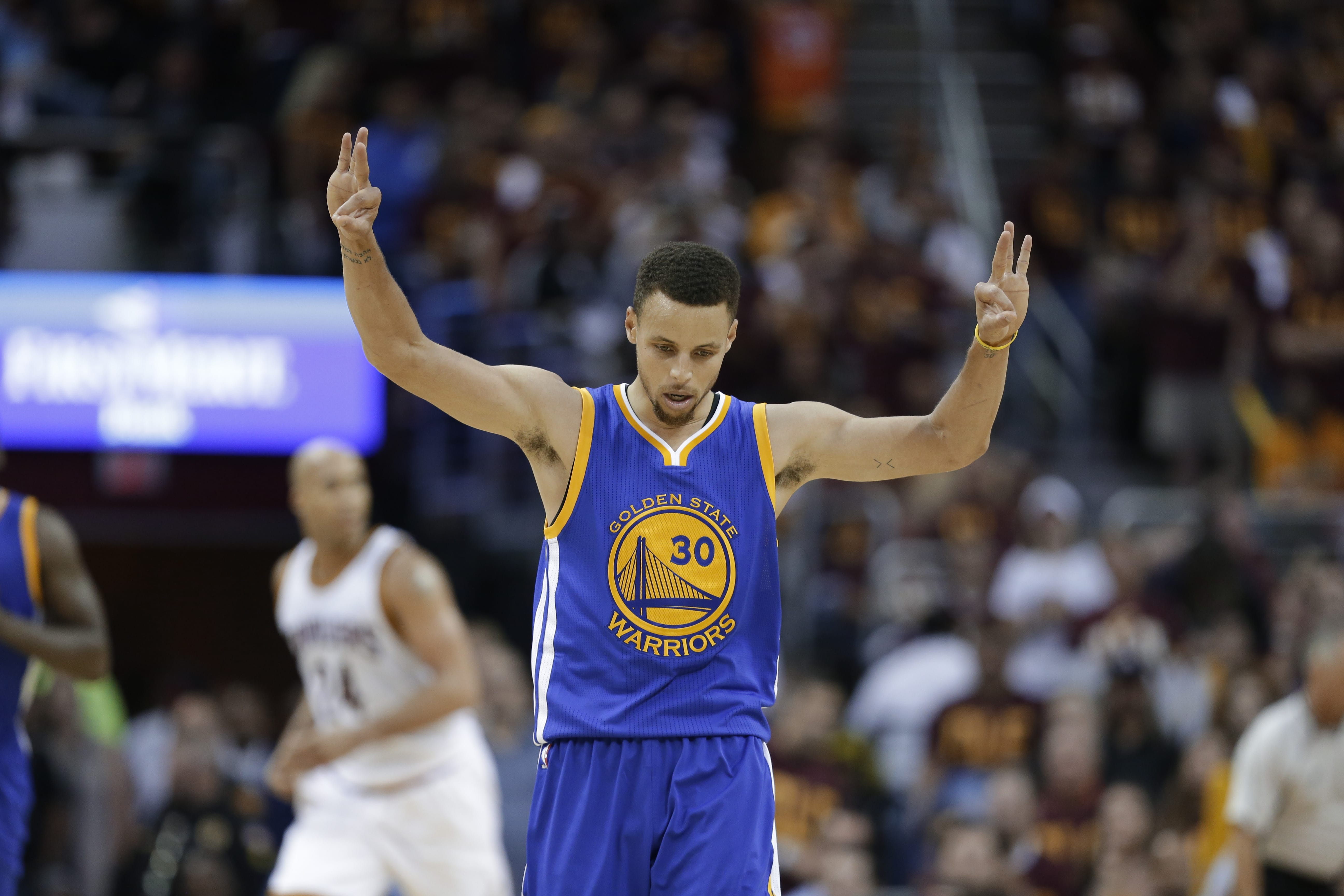 Golden State Warriors guard Stephen Curry (30) celebrates a basket against the Cleveland Cavaliers during the second half of Game 4 of basketball's NBA Finals in Cleveland, Friday, June 10, 2016.
