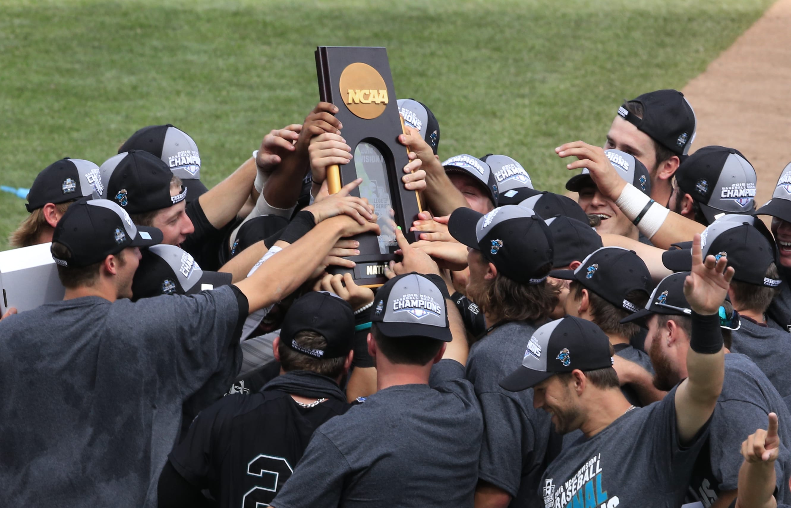 Coastal Carolina players celebrate their 4-3 victory over Arizona to win the championship after Game 3 of the NCAA College World Series baseball finals in Omaha, Neb., Thursday, June 30, 2016.