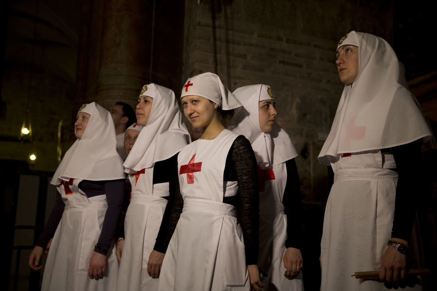 Christian nuns watch as a team of experts begin the renovation of Jesus&#039; tomb in the Church of the Holy Sepulchre in Jerusalem&#039;s old city, Monday, June 6, 2016. A team of experts has begun a historic renovation at the spot where Christians believe Jesus was buried, overcoming longstanding religious rivalries to carry out the first repairs at the site in over 200 years.