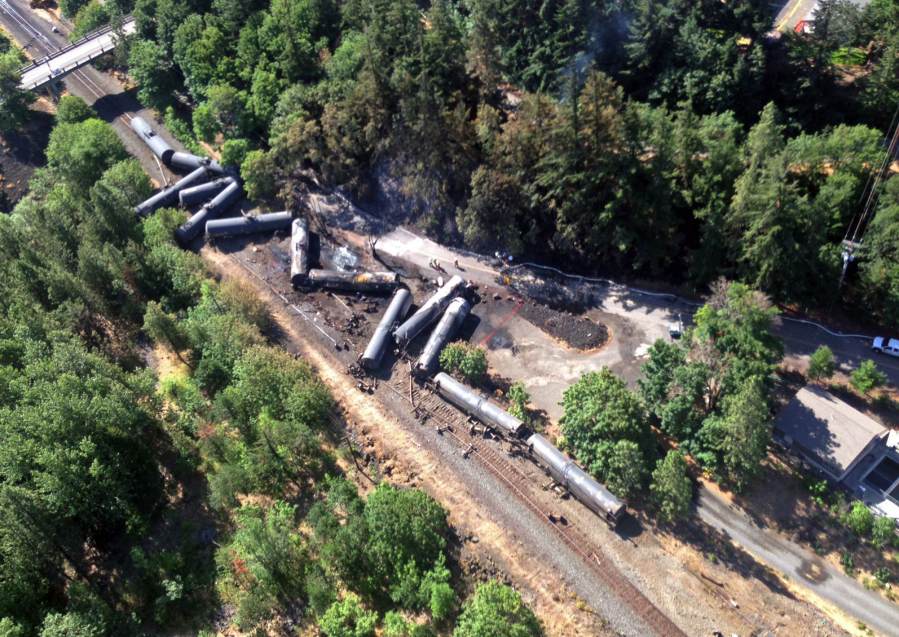 This aerial view provided by the Washington State Department of Ecology shows scattered and burned oil tank cars June 4 after a train derailed and burned near Mosier, Ore. Union Pacific Railroad said it had recently inspected the section of track near Mosier, about 70 miles east of Portland, and that it had been inspected at least six times since March 21.