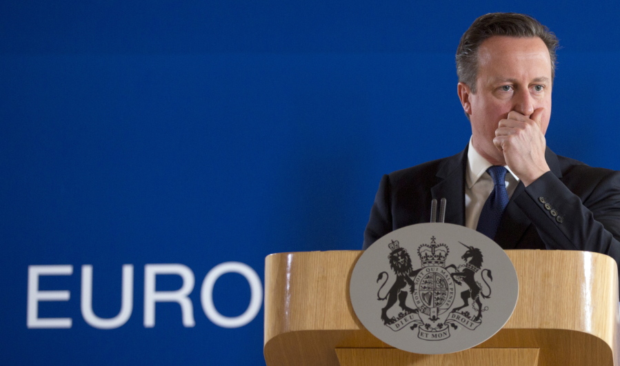British Prime Minister David Cameron pauses before speaking during a media conference at an EU summit in Brussels.