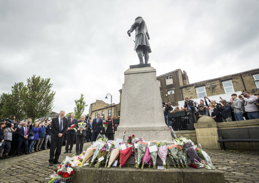Labour Party leader Jeremy Corbyn, Hilary Benn MP, Commons Speaker John Bercow and Prime Minister David Cameron, from left,  lay floral tributes in Birstall, northern England, for Jo Cox, the 41-year-old British Member of Parliament shot to death in northern England on Friday. The mother of two young children was shot to death Thursday afternoon in her constituency near Leeds. A 52-year-old man has been arrested but has not been charged.