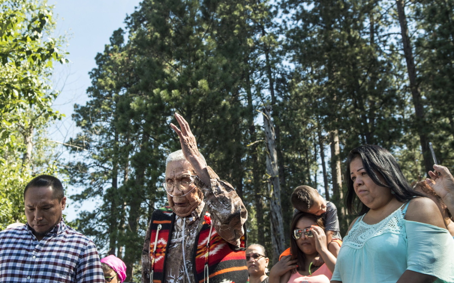 Coeur d&#039;Alene tribe elder Felix Aripa says a prayer Tuesday before the launching of the dugout canoe from Lake Coeur d&#039;Alene, Idaho.