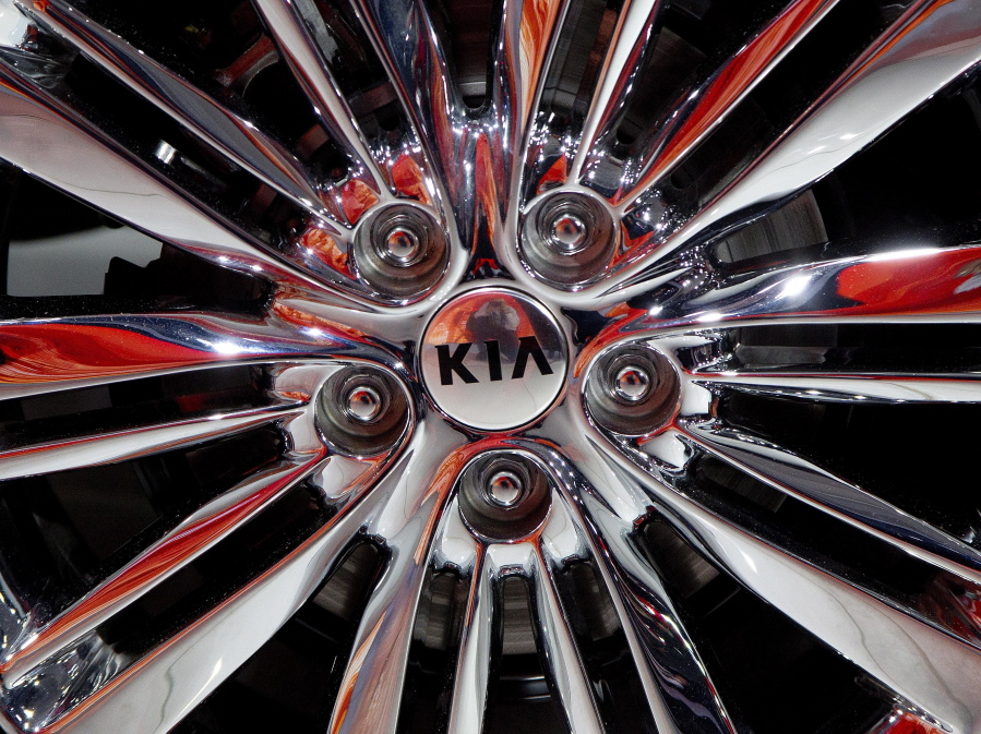 This Wednesday, April 1, 2015, file photo shows a wheel of the 2016 Kia Optima on display at the New York International Auto Show. Despite adding sophisticated electronic safety features and touch screens that once were prone to glitches, most automakers improved their reliability scores this year in an annual survey of new-car buyers.