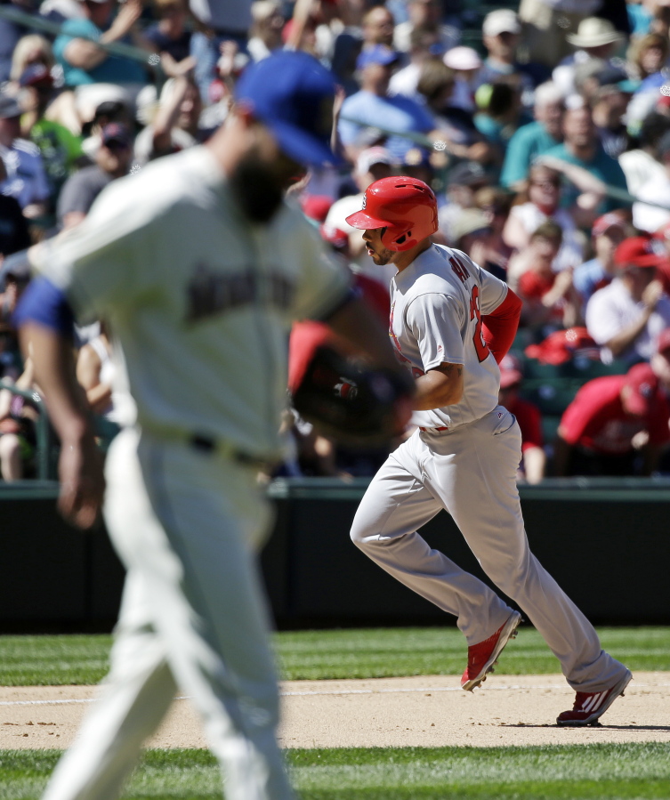 St. Louis Cardinals&#039; Thomas Pham, right, circles the bases on his home run as as Seattle Mariners relief pitcher Nick Vincent looks away in the seventh inning of a baseball game Sunday, June 26, 2016, in Seattle.
