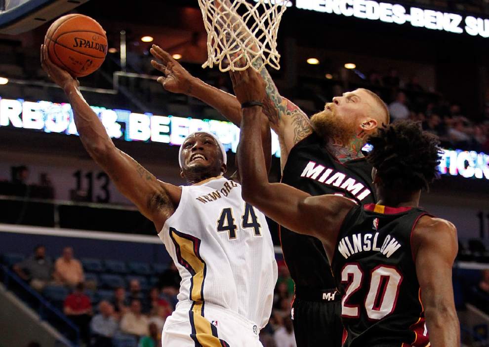 New Orleans' Dante Cunningham shoots over Miami's Chris Andersen.