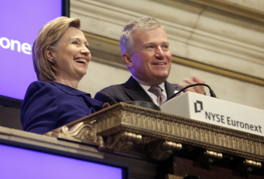 Then-Secretary of State Hillary Rodham Clinton  rings the New York Stock Exchange opening bell, accompanied by then-NYSE CEO Duncan L. Niederauer, in New York on Sept. 21, 2009.