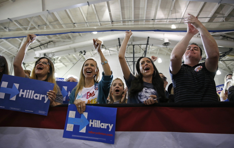 People cheer as Democratic presidential candidate Hillary Clinton speaks at a rally Friday in Culver City, Calif.