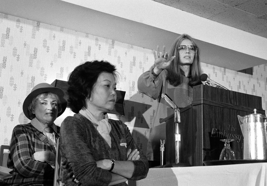 Bella Abzug, from left, and Patsy Mink of Women USA sit next to Gloria Steinem on Nov. 21, 1979, as she speaks in Washington.