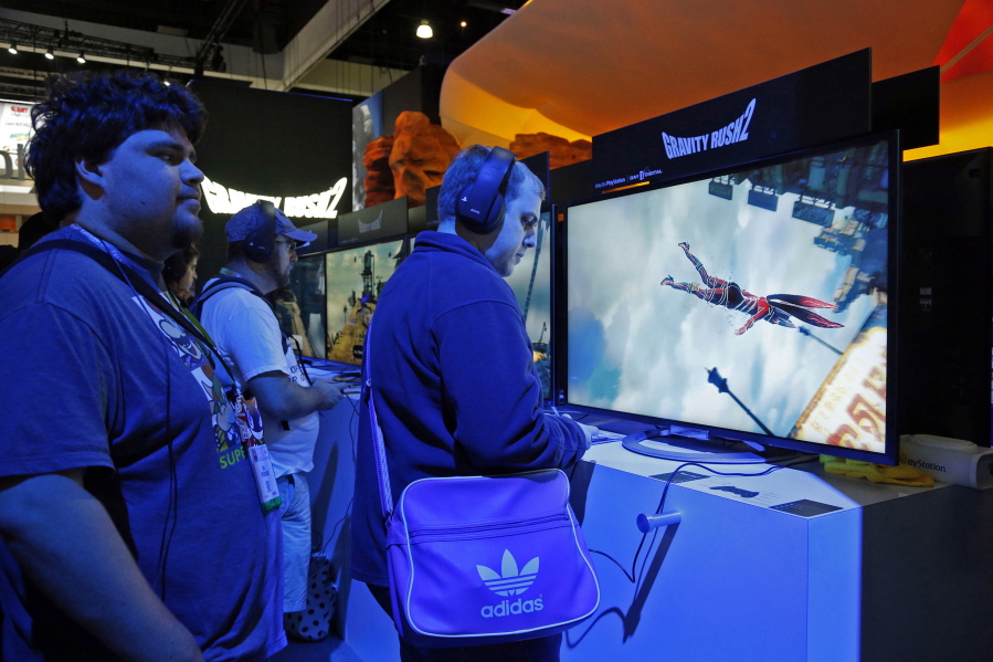 Players check out the PlayStation Gravity Rush 2 video game at the Electronic Entertainment Expo in Los Angeles on Wednesday.