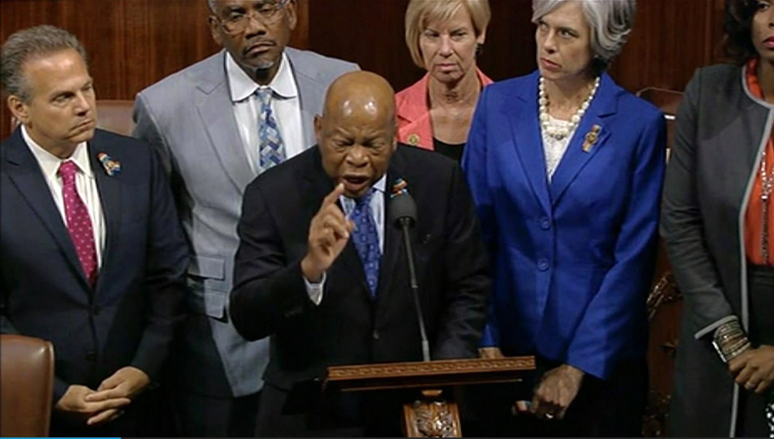 In this frame grab taken from AP video Georgia Rep. John Lewis leads more than 200 Democrats in demanding a vote on measures to expand background checks and block gun purchases by some suspected terrorists in the aftermath of last week's massacre in Orlando, Florida, that killed 49 people in a gay nightclub.  Rebellious Democrats shut down the House's legislative work on Wednesday, June 22, 2016, staging a sit-in on the House floor and refusing to leave until they secured a vote on gun control measures before lawmakers' weeklong break.