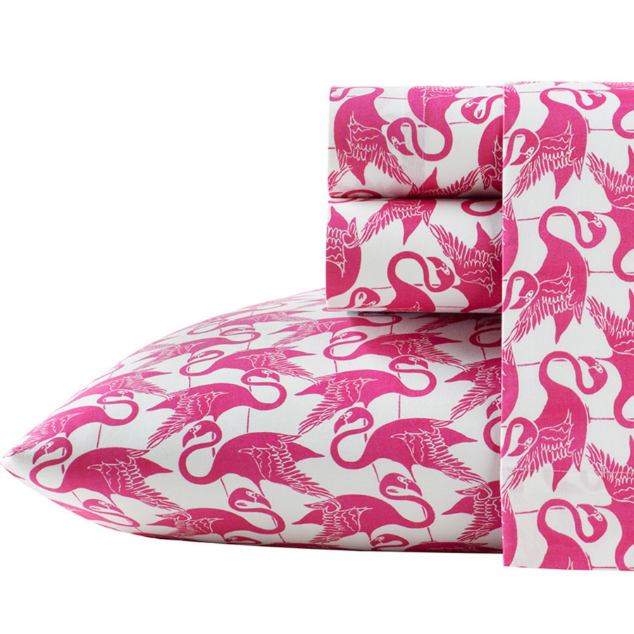 Bedding with a fun flamingo print brings the tropical decor theme into the bedroom.