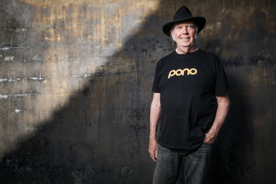 Neil Young&#039;s new album, &quot;Earth,&quot; available Friday, is a collection of 13 live songs interspersed with the sounds of crickets, frogs, crows, bees and other animals Young recorded in his backyard.