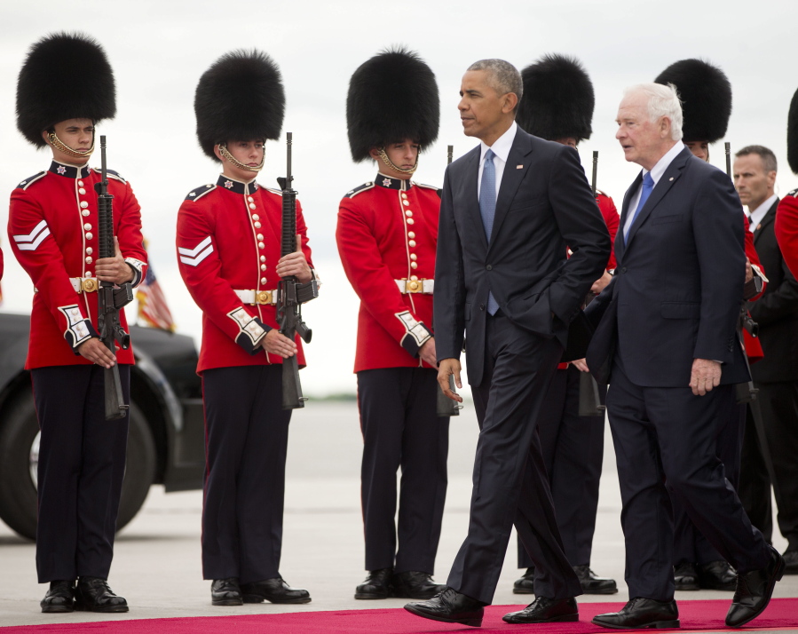 President Barack Obama walks with Governor General of Canada David Johnston on the tarmac upon his arrival on Air Force One, at Ottawa Macdonald-Cartier International Airport in Ottawa, Canada, on Wednesday. Obama traveled to Ottawa for the North America Leaders&#039; Summit with Canadian Prime Minister Justin Trudeau and Mexican President Enrique Pena Neito.