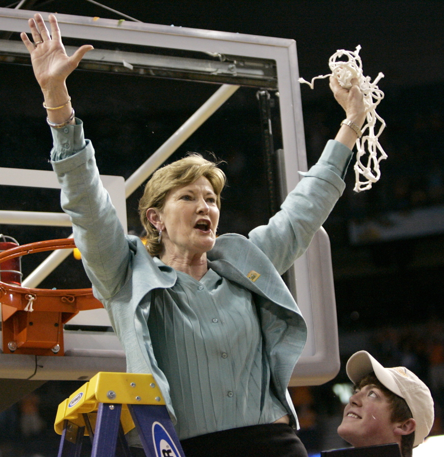 FILE - In this April 8, 2008, file photo, Tennessee coach Pat Summitt holds up the net as her son, Tyler, looks on after Tennessee beat Stanford 64-48 to win its eighth national women&#039;s basketball championship, at the NCAA women&#039;s basketball tournament Final Four in Tampa, Fla.  Summitt, the winningest coach in Division I college basketball history who uplifted the women&#039;s game from obscurity to national prominence during her career at Tennessee, died Tuesday morning, June 28, 2016. She was 64.