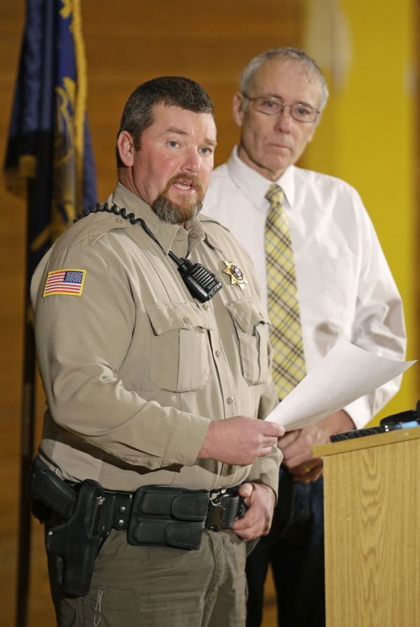 Harney County Sheriff David Ward, left, speaks Jan. 4 as Harney County Judge Steven Grasty listens in Burns, Ore. Voters in Burns are receiving ballots in the mail this week for a June 28 recall election targeting Grasty, who opposed a group of armed ranchers when they took over a nearby federal wildlife refuge earlier this year.