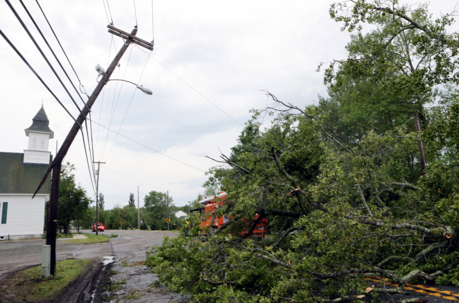 Route 47 in Middle Township is blocked to traffic Tuesday due to fallen trees and power lines in front of the United Methodist Church in Green Creek, N.J.