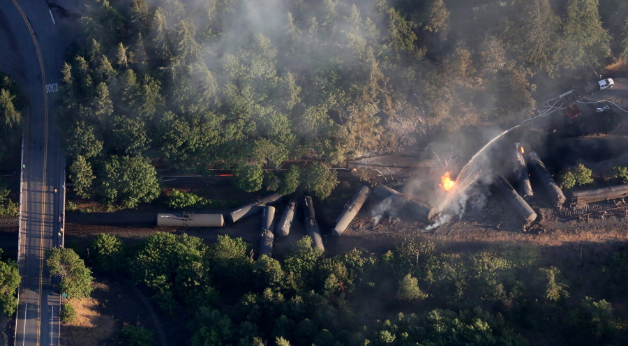 An oil train burns after derailing Friday near Mosier, Ore., about 70 miles east of Portland.
