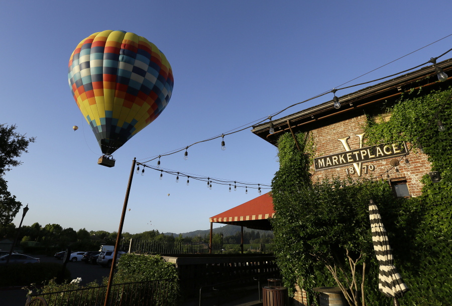 A hot air balloon lifts off at sunrise from Napa Valley Aloft in Yountville, Calif. Whether you&#039;re hurtling down a zip line or floating through the air in a hot air balloon, you have a few options when it comes to flying high in wine country.