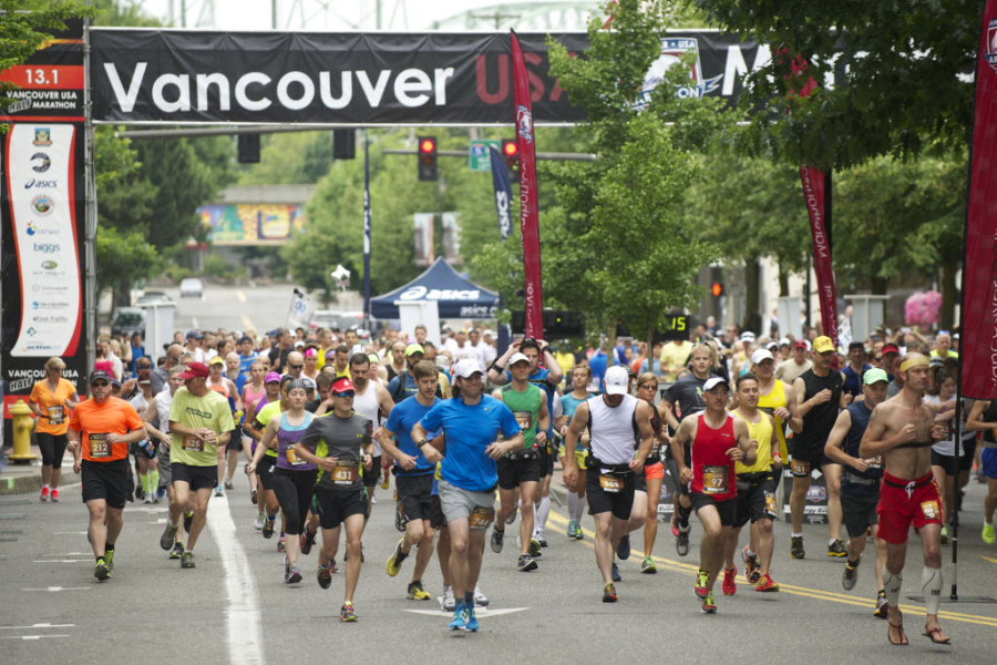 Runners leave the start line for the Vancouver USA Marathon in downtown Vancouver.