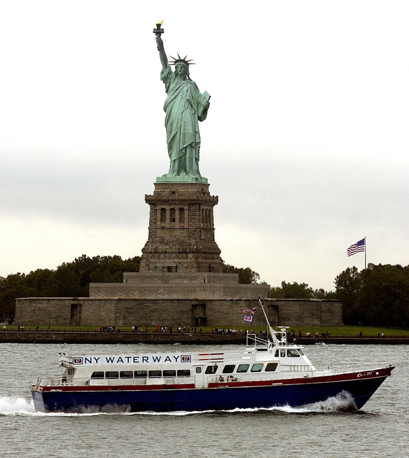 The Statue of Liberty stands on Liberty Island in New York Harbor.