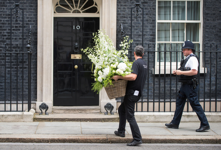 A large bouquet of flowers is delivered Friday to 10 Downing Street in London Theresa May became Britain&#039;s prime minister on Wednesday.