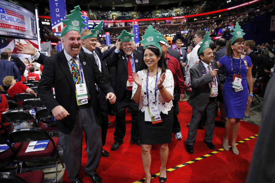 Washington delegates, along with state Sen. Don Benton, R-Vancouver, third from left, cheer Tuesday during the second day of the Republican National Convention in Cleveland.