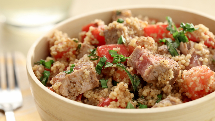 Steamed couscous, grilled fresh tuna and a basil-laced tomato salad come together in an easy summer recipe.