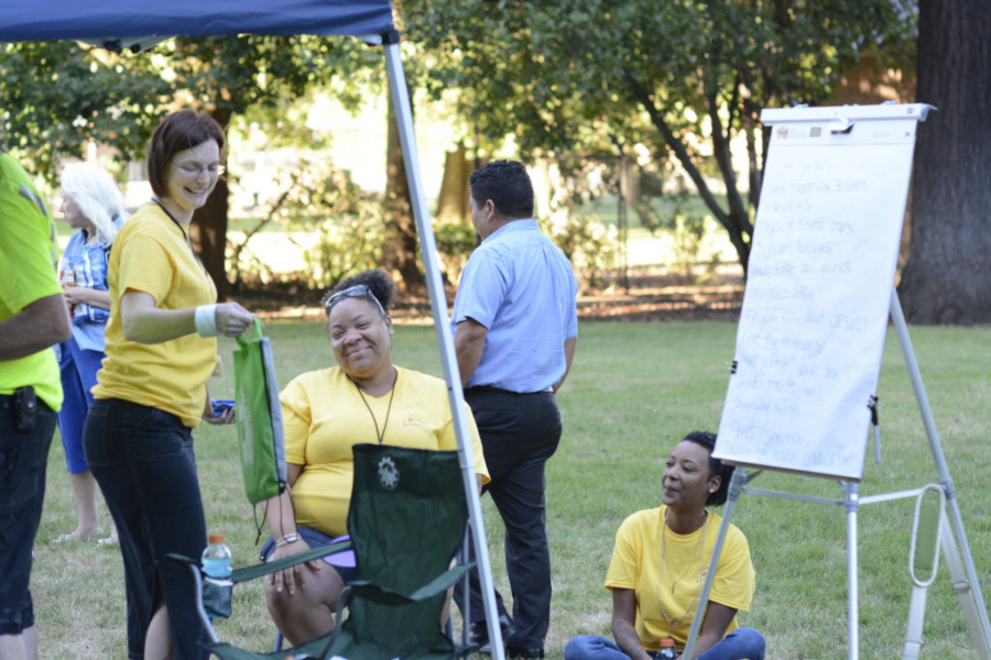 Community health workers from Rose Village celebrate National Night Out 2015 at Water Works Park.