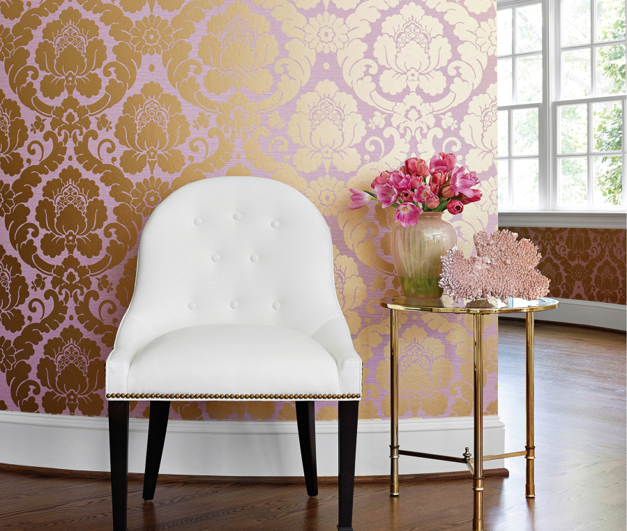 Thibaut&#039;s Anna French collection Marlow wallpaper has a large-scale pattern in a mauve-pink ground with a metallic gold damask.