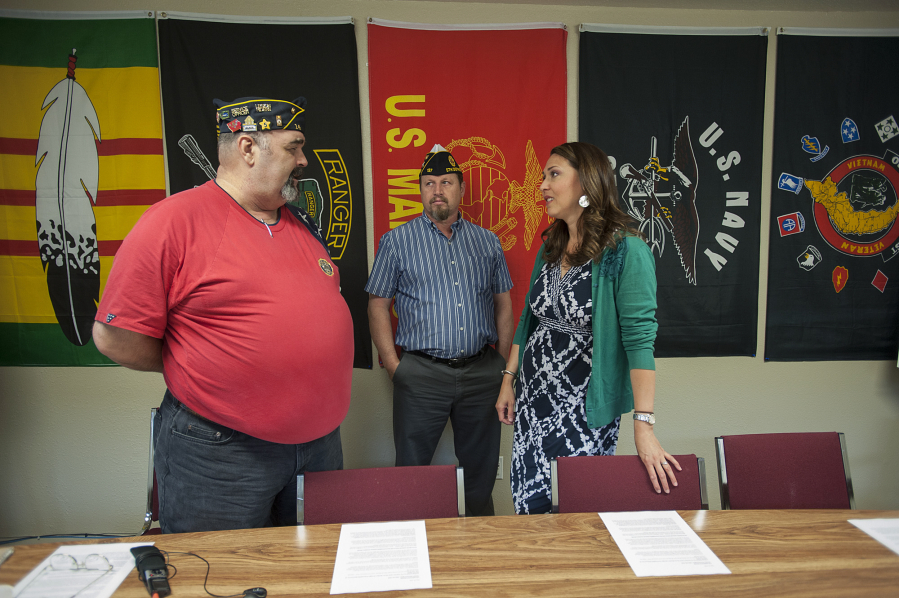 Veterans Jerry Vincent, from left, and Kevin Russell chat with U.S. Rep. Jaime Herrera Beutler, R-Camas, before the start of the meeting Tuesday morning to address veterans&#039; health care at the Clark County Veterans Assistance Center.