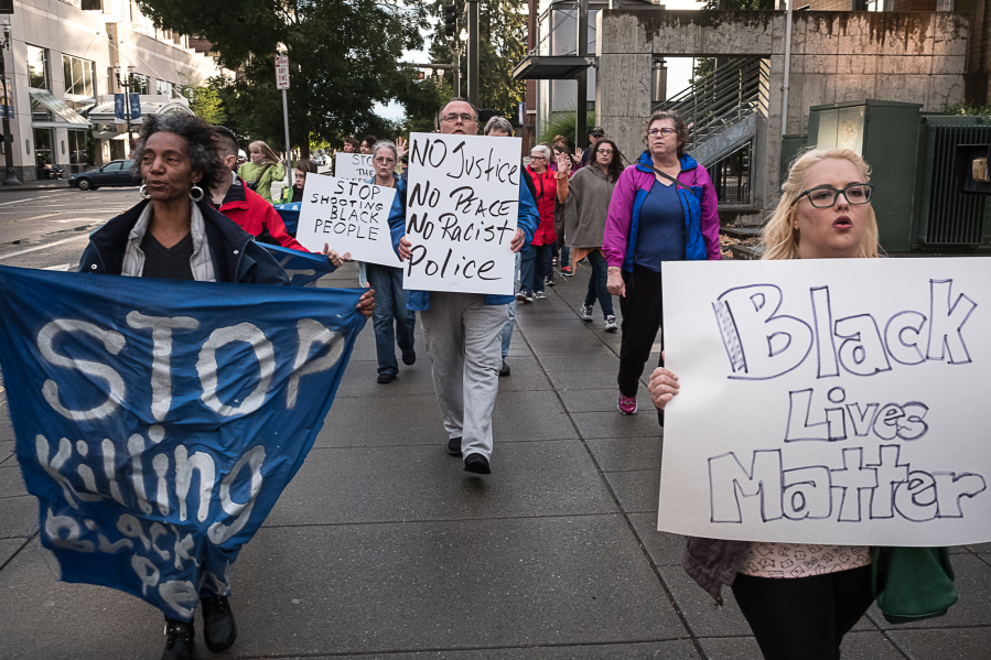 Miranda Bickord, right, and Cecelia Towner, left, lead a Black Lives Matter march in downtown Vancouver on Friday night.