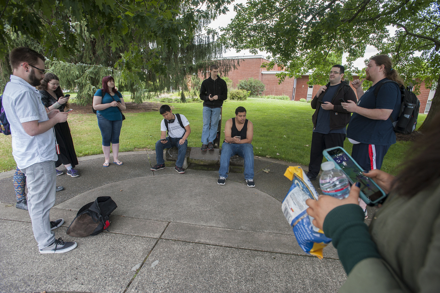 A crowd of Clark College students and Vancouver residents play &quot;Pokemon Go&quot; at Clark College on Tuesday. Since being released July 6, the game has become a cultural phenomenon.