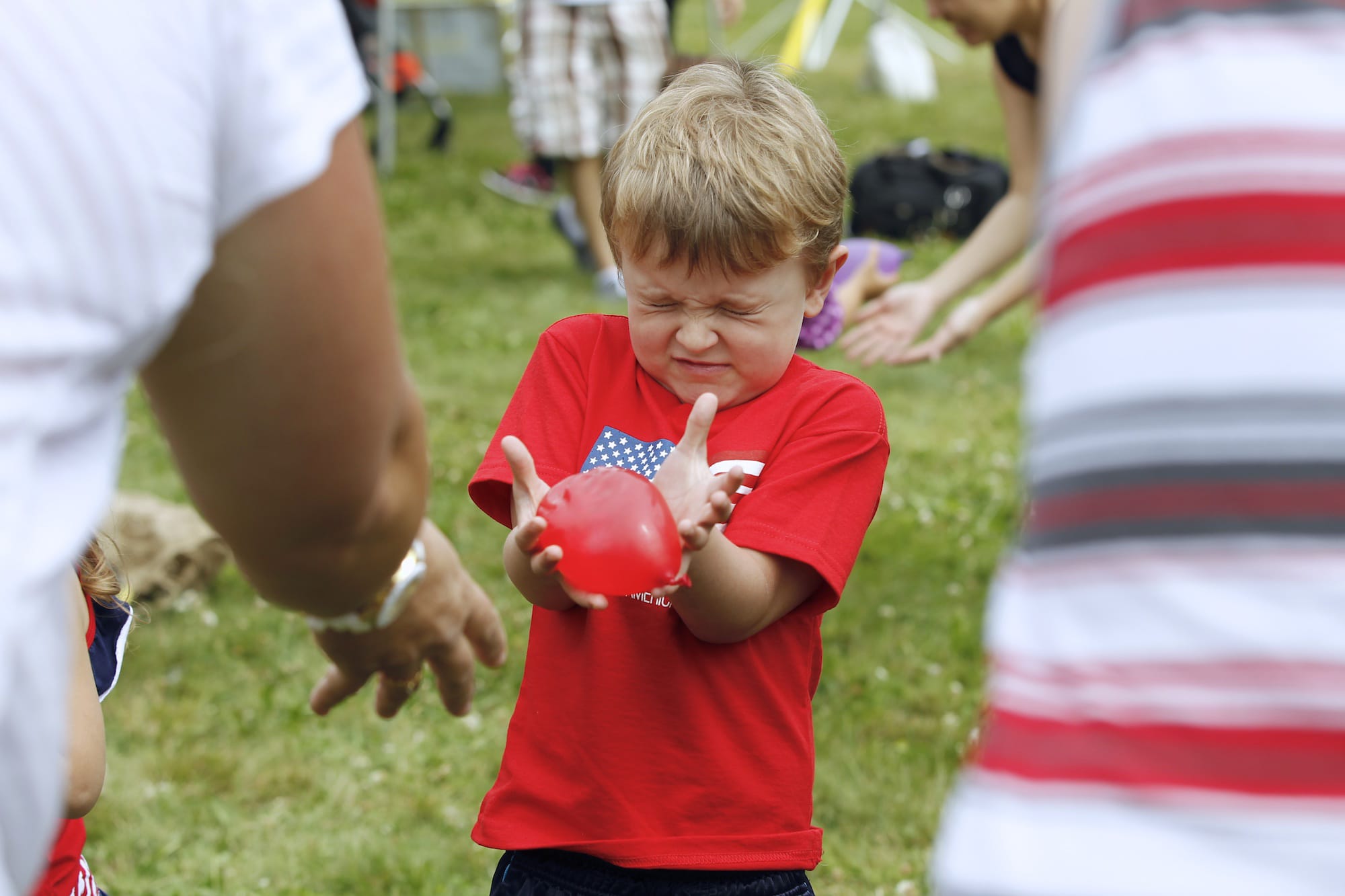 Mason Weyland, 4 of Vancouver participates in the water balloon toss at the 4th of July celebration at Fort Vancouver.