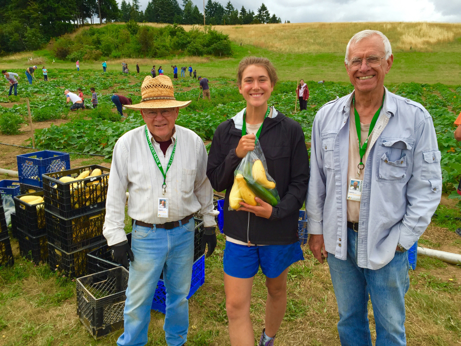 Hazel Dell: David Luckett, Churches in Partnership volunteer, Lauren Krug, Clark County Food Bank farming coordinator, and Larry Grell, partnership leader, at the 78th Street Heritage Farm, where the partnership recently surpassed 100 tons of food harvested and donated to the Clark County Food Bank.