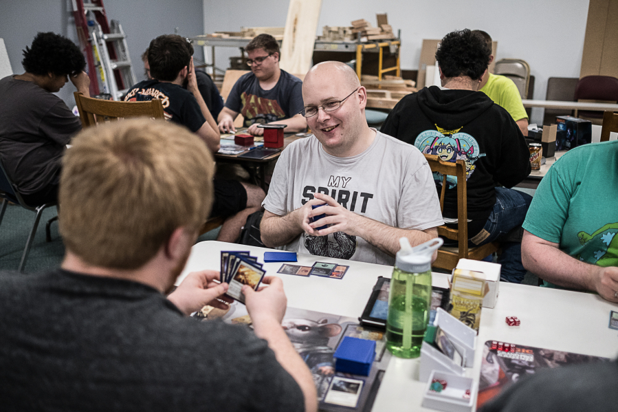 Ryan Garringer, manager of Bat Cave Games, plays a round of &quot;Magic: The Gathering&quot; with Joe Boitano.