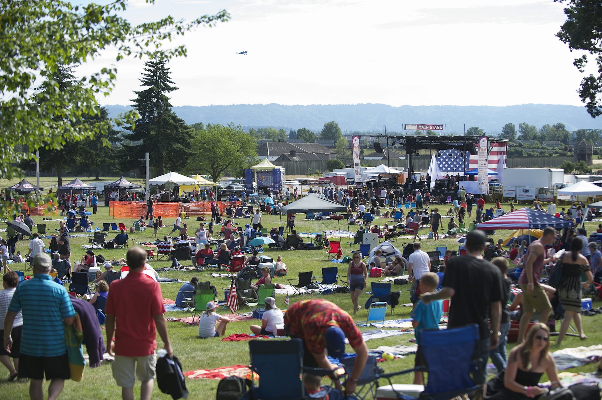 A crowd enjoys a sunny afternoon during the Fourth of July celebration at Fort Vancouver on July 4, 2014.