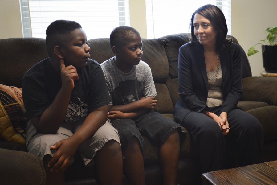 Keyonne Hill, 10, left, and Horace Hill, 9, speak with U.S. Senator Maria Cantwell about living at Lilac Place Apartments in Woodland. Cantwell visited Lilac Place on Friday to speak with Cowlitz County affordable housing agencies and local officials about the need for more affordable housing in the region.