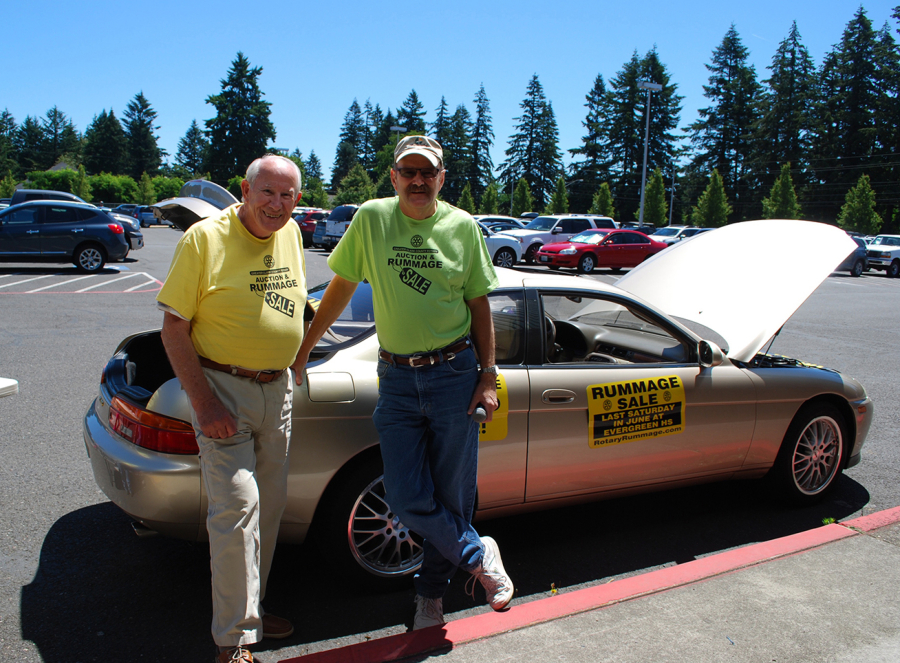 East Vancouver: Rotary Club of Greater Clark County member Paul Mabie, left, stands with Andy Huck, auctioneer at the group&#039;s second Rummage Sale and Auction on June 25.