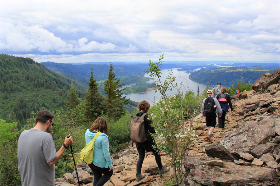 Hikers head down the trail after reaching the top on a recent Saturday morning in the Columbia River Gorge.