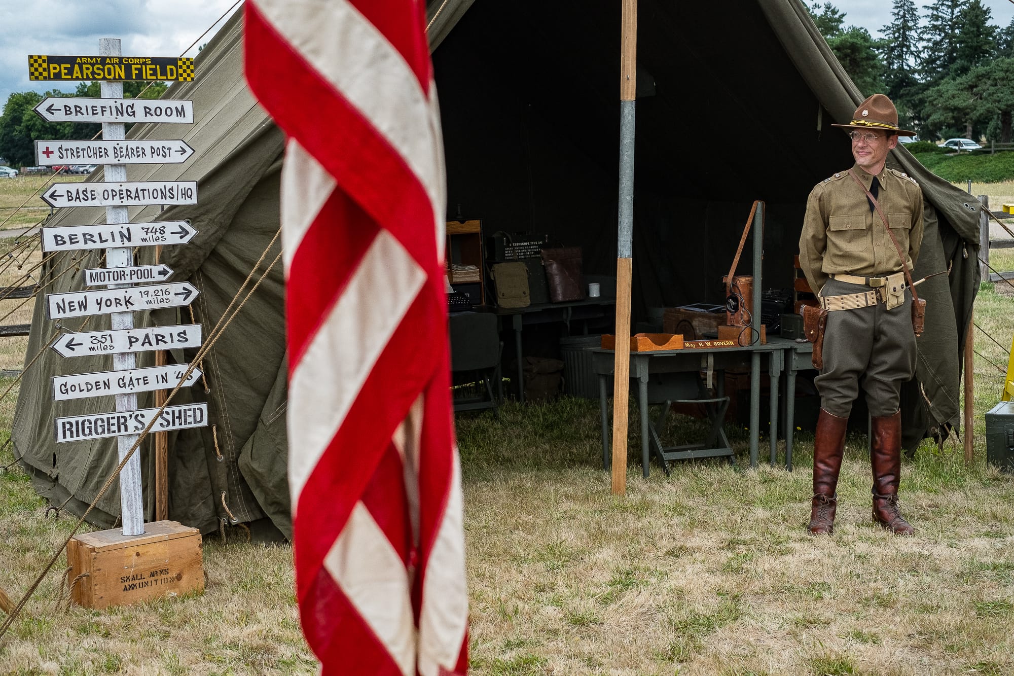 Christopher Miller, military memorabilia  collector and member of Living History Group NorthWest, stands in front a tent at the WWII Encampment display at Fort Vancouver on Saturday.