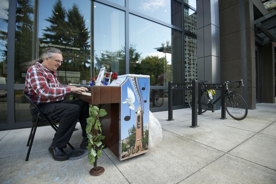 There&#039;s nothing like a little sidewalk sound. In this file photo from 2012, musician Dezy Walls avails himself of a public piano in front of Vancouver City Hall. This year, the School of Piano Technology for the Blind will place 16 decorated pianos around Clark County and Portland during its Keys to The City event Aug.