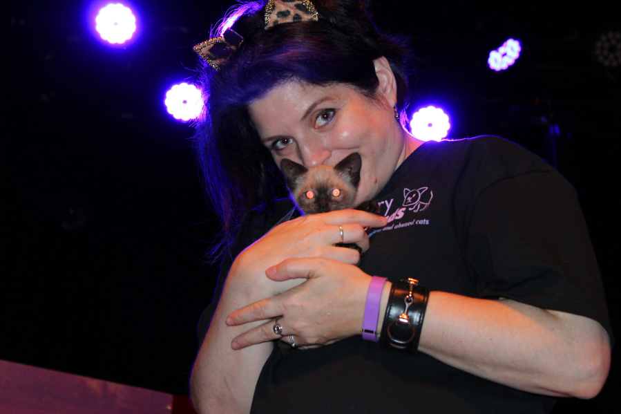 Walnut Grove: Furry Friends volunteer Marci Koski and one of the Amazing Acro-Cats at the Portland show for the traveling circus troupe, which donated $920 to the Vancouver-based shelter.