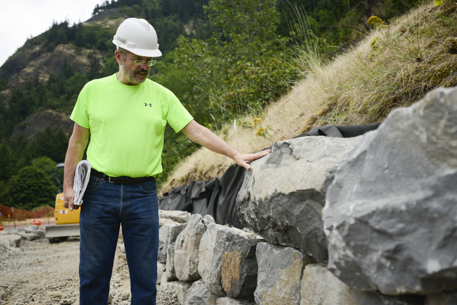 Landscape architect and rock-project manager Kelly Punteney of Colf Construction describes what he digs and doesn&#039;t dig in slabs of basalt. Punteney, a Vancouver resident and former parks and recreation official here, has been helping to build a new 1.32-mile segment of the Historic Columbia River Highway and State Trail near Hood River, Ore.