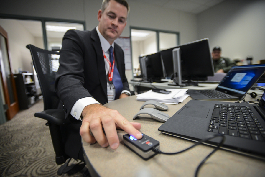 A scanner recognizes the fingerprint of Justin Davis. Davis&#039; company, Executive Information Systems, sold the county the new biometric technology being implemented at the Clark County Jail.