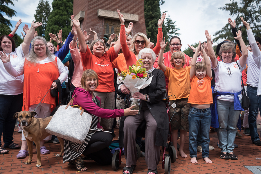 Joyce Kilpatrick, former executive director of YWCA Clark County, center, is joined by YWCA staff, volunteers and supporters at the organization&#039;s 100th anniversary celebration Sunday afternoon at Esther Short Park in downtown Vancouver.